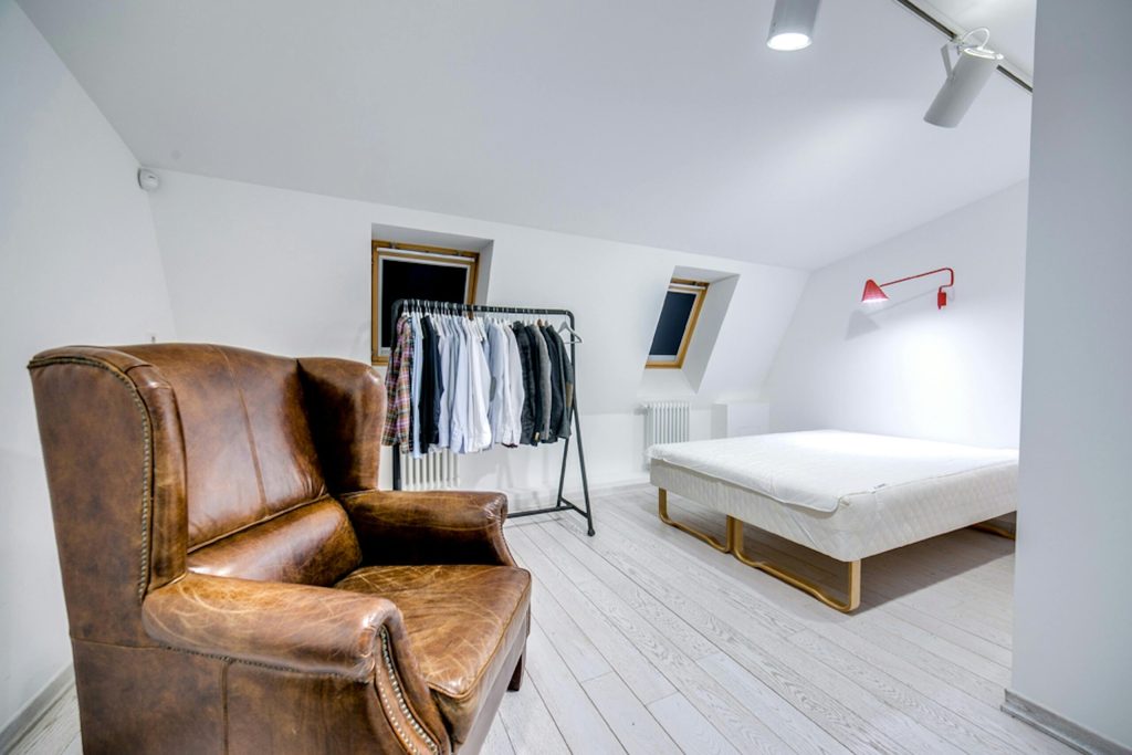 Bedroom with two skylight roof windows in a sloped ceiling